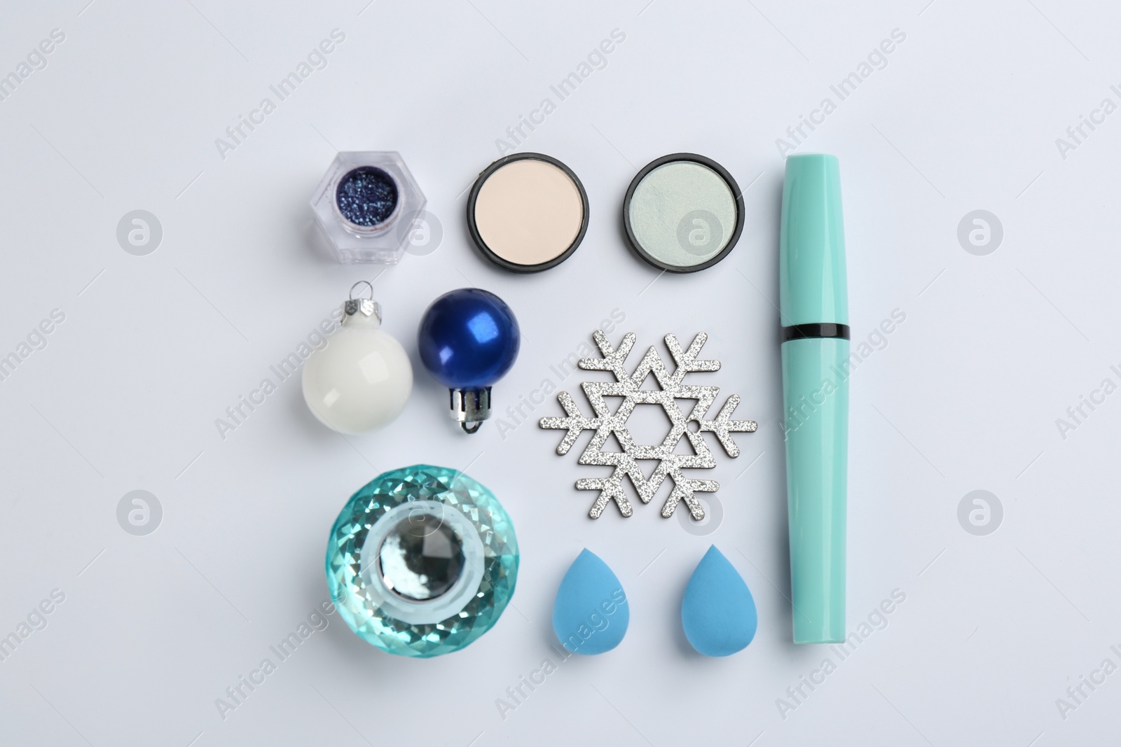 Photo of Flat lay composition with decorative cosmetic products on light background. Winter care