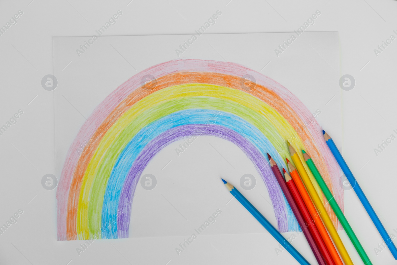 Photo of Painting of rainbow and pencils on white background, flat lay. Stay at home concept