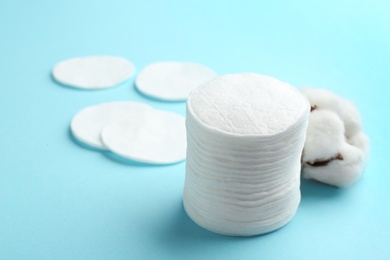 Cotton pads on color background. Space for text