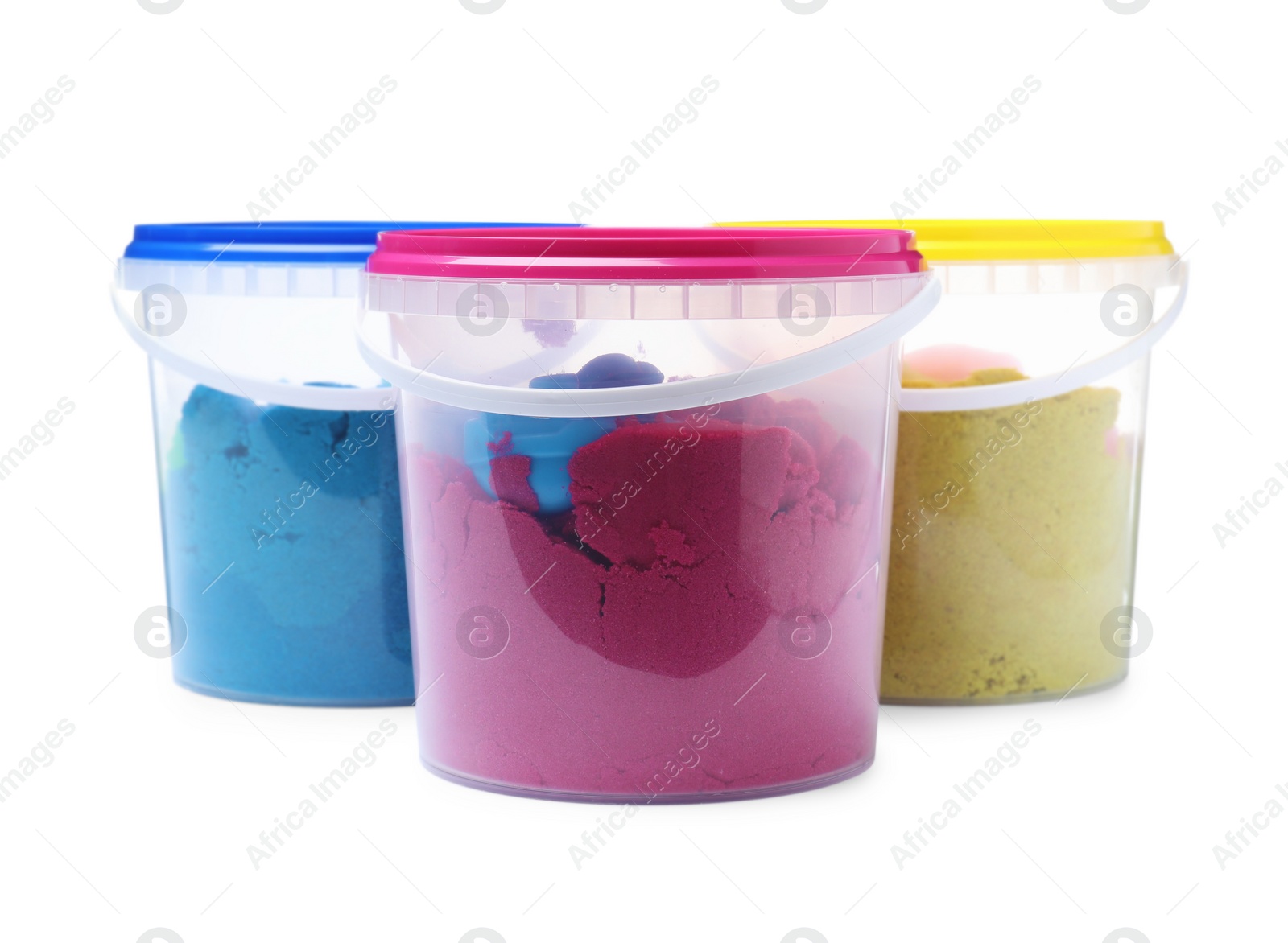 Photo of Kinetic sand and toys in buckets on white background