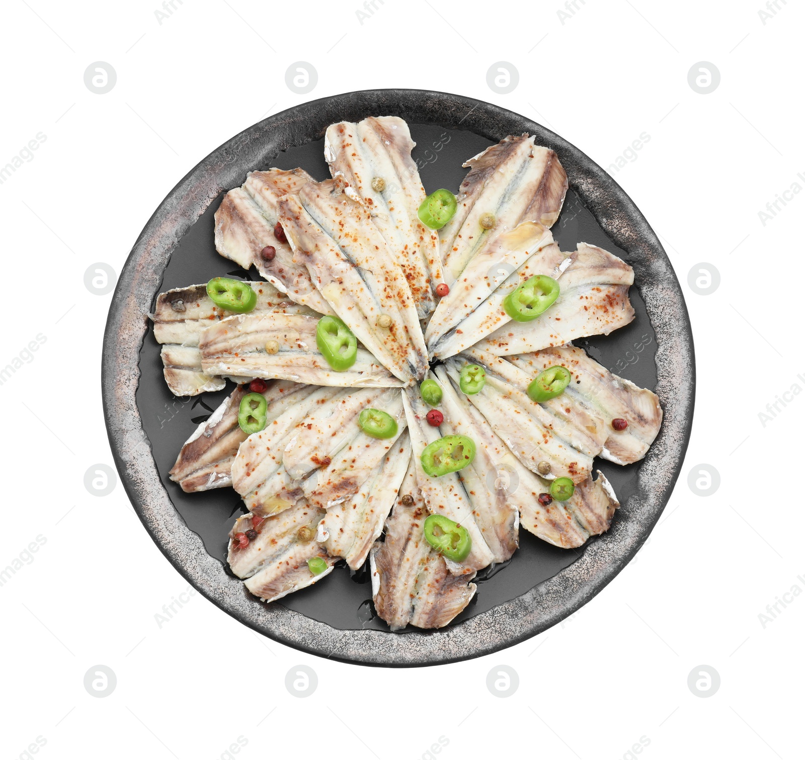 Photo of Tasty pickled anchovies with spices isolated on white, top view