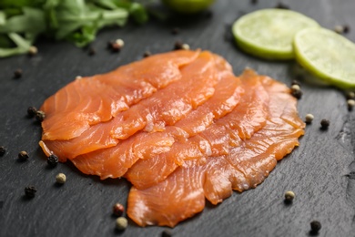 Photo of Fresh sliced salmon fillet on slate plate