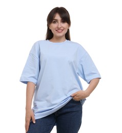 Smiling woman in stylish light blue t-shirt on white background