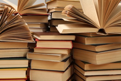 Photo of Many books as background, closeup. Library material