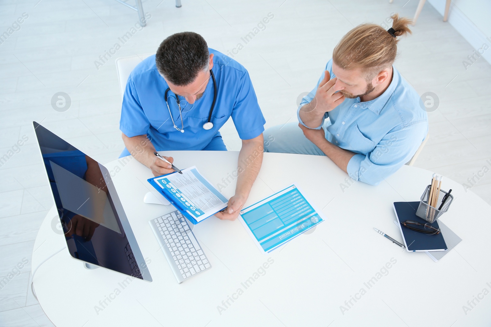 Photo of Man with health problems visiting urologist at hospital