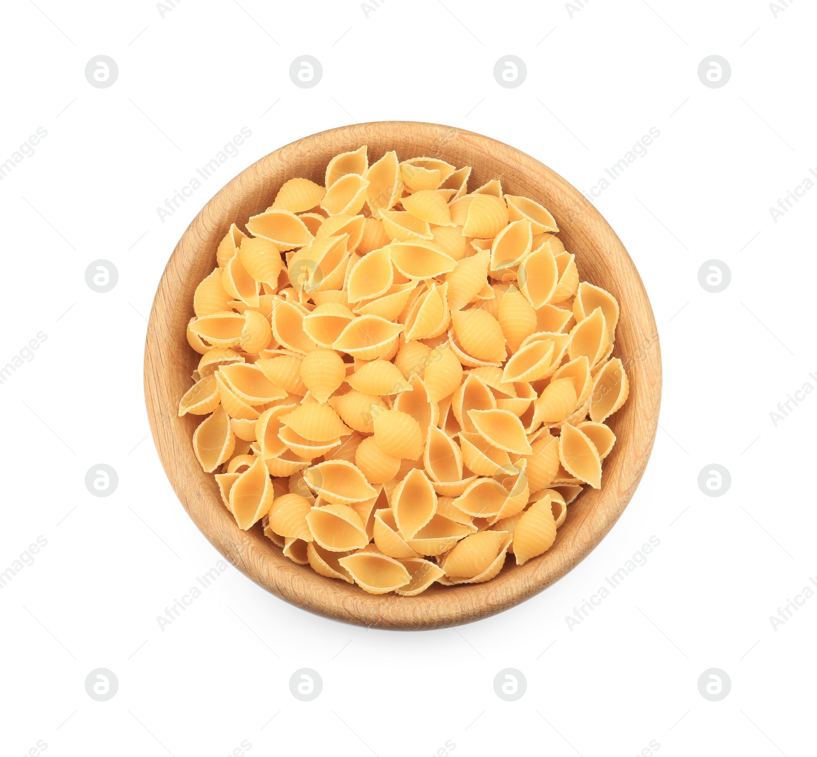 Photo of Raw conchiglie pasta in bowl isolated on white, top view