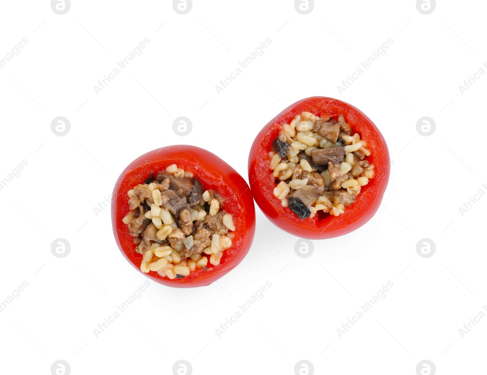 Photo of Delicious stuffed tomatoes with minced beef, bulgur and mushrooms isolated on white, top view