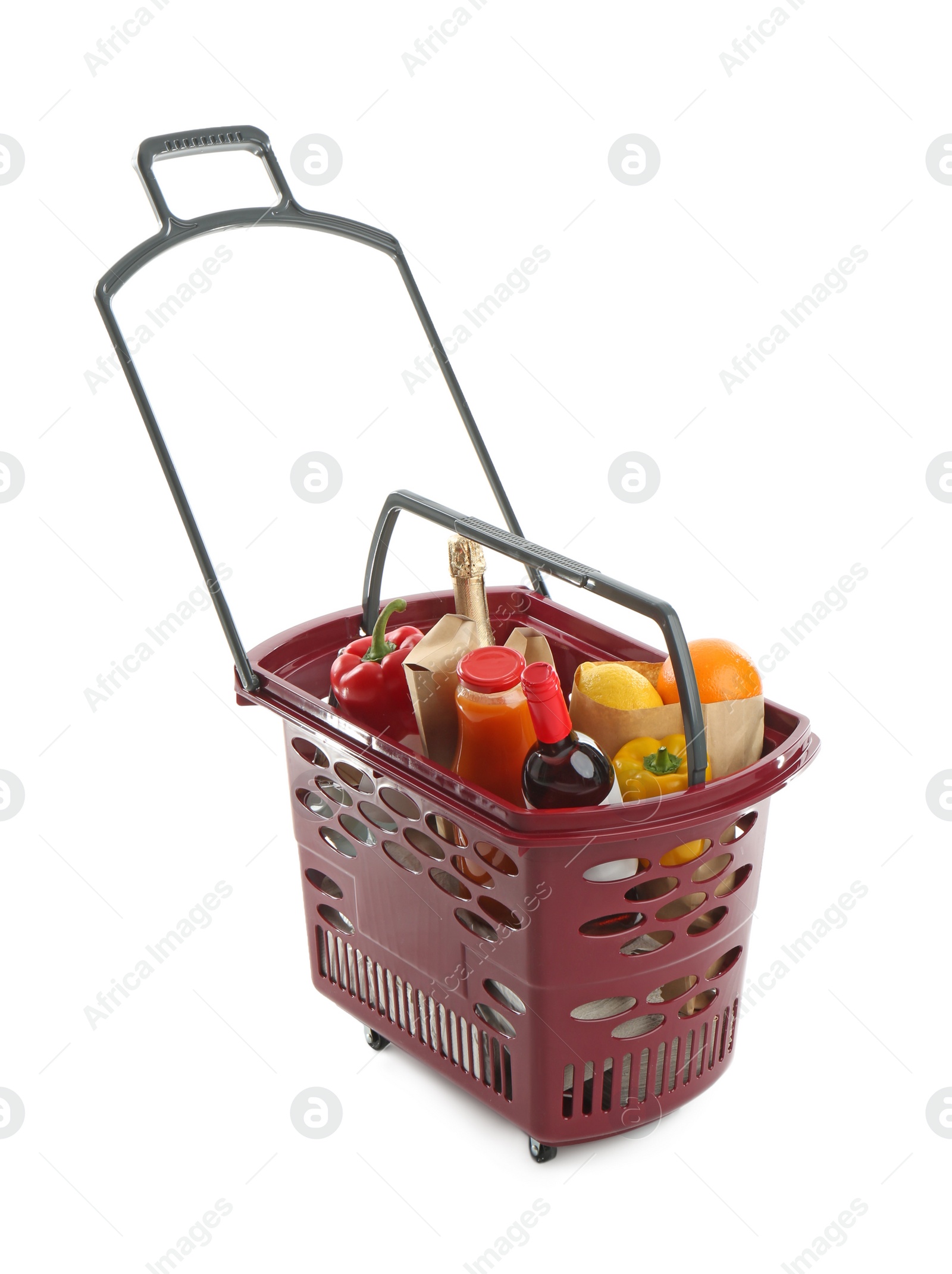 Photo of Shopping basket full of different products isolated on white