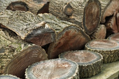 Photo of Pile of cut firewood, closeup view. Heating in winter