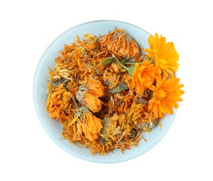 Photo of Plate with dry and fresh calendula flowers on white background, top view