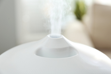 Photo of Modern air humidifier at home, closeup view