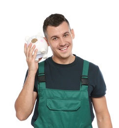 Photo of Portrait of male worker in uniform with piggy bank on white background
