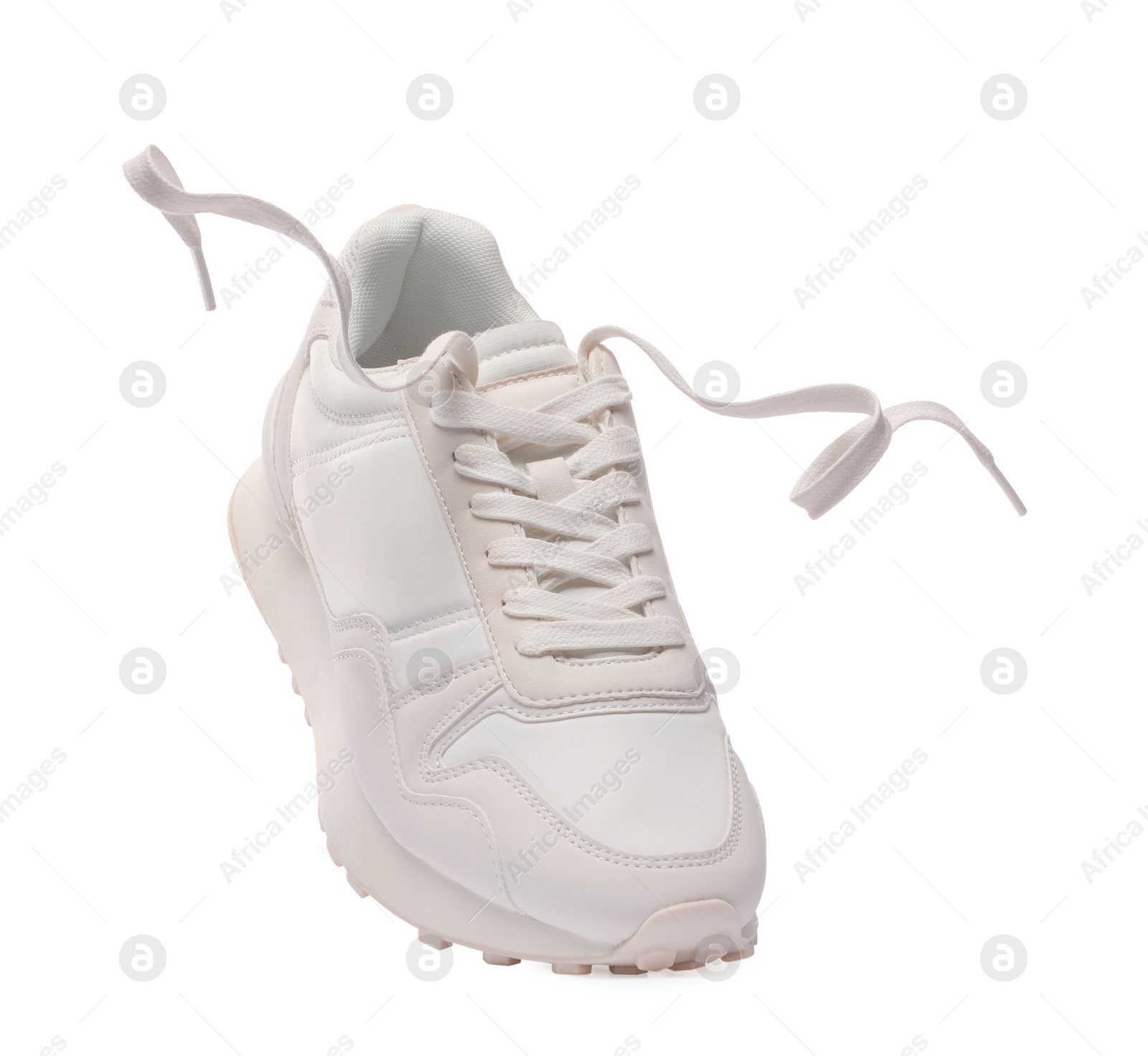 Photo of One stylish new sneaker isolated on white