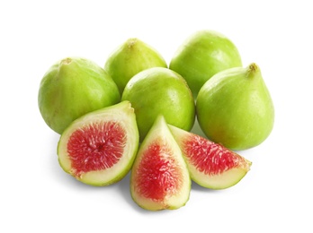 Whole and cut green figs on white background