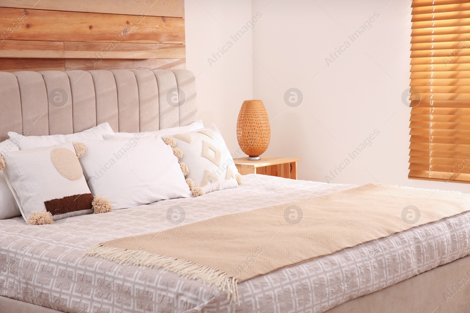 Photo of Stylish hotel room interior with comfortable bed