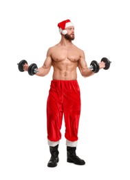 Photo of Attractive young man with muscular body in Santa hat holding dumbbells on white background