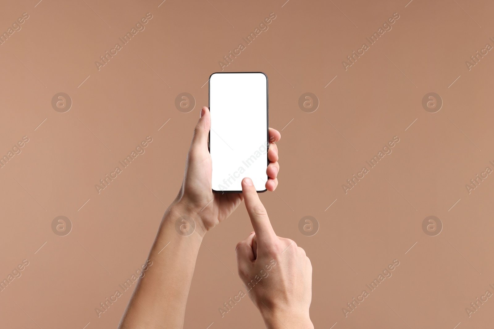 Photo of Man using smartphone with blank screen on beige background, closeup. Mockup for design