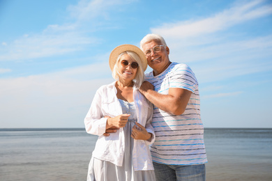 Photo of Mature couple spending time together near sea