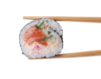 Photo of Chopsticks with tasty sushi roll on white background, closeup