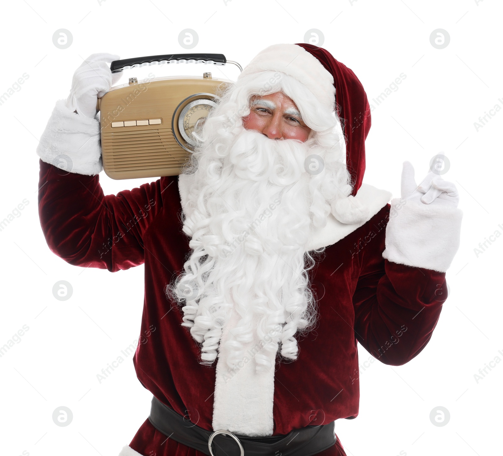 Photo of Santa Claus with vintage radio on white background. Christmas music