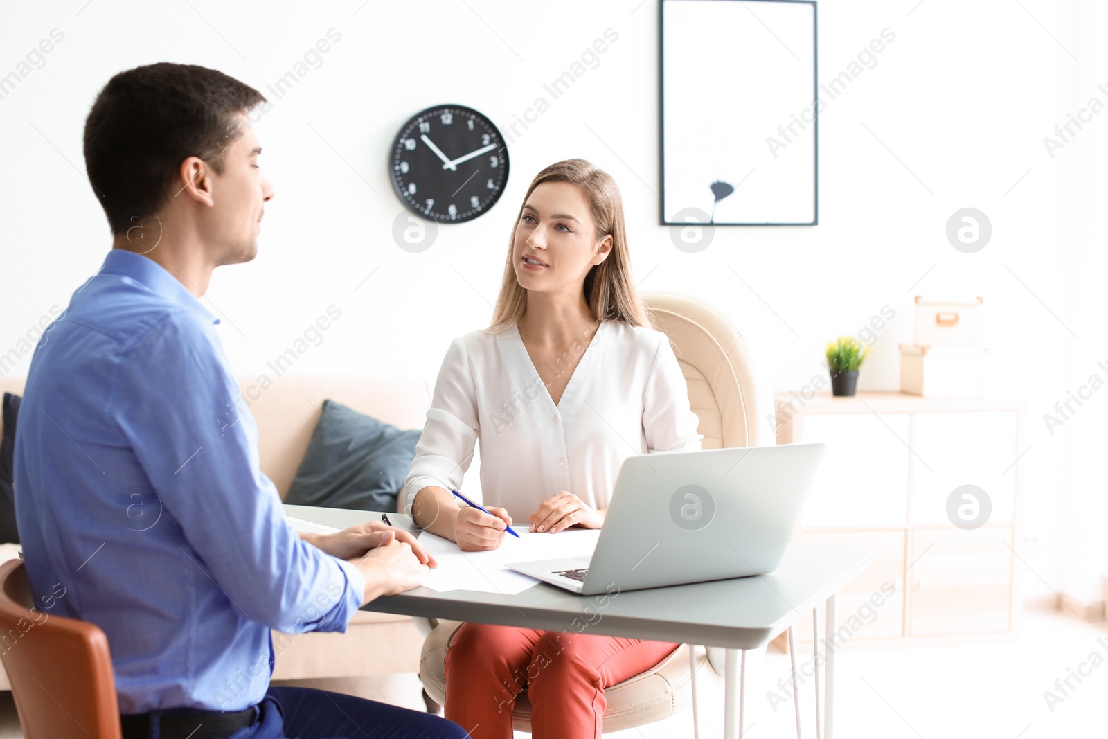 Photo of Human resources manager conducting job interview with applicant in office