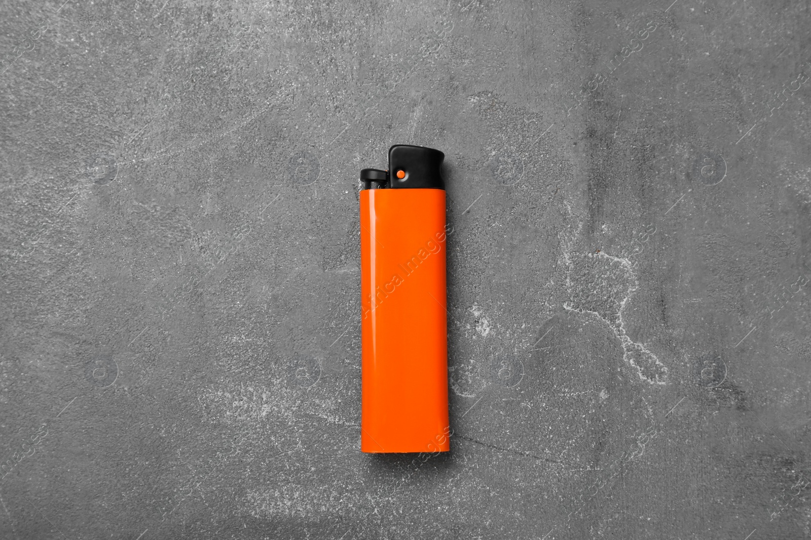 Photo of Stylish small pocket lighter on grey table, top view