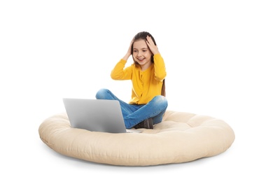 Photo of Little girl using video chat on laptop, white background