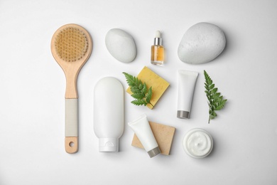 Photo of Flat lay composition with different body care products on white background