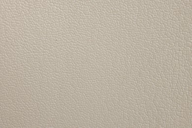 Photo of Beautiful beige leather as background, top view