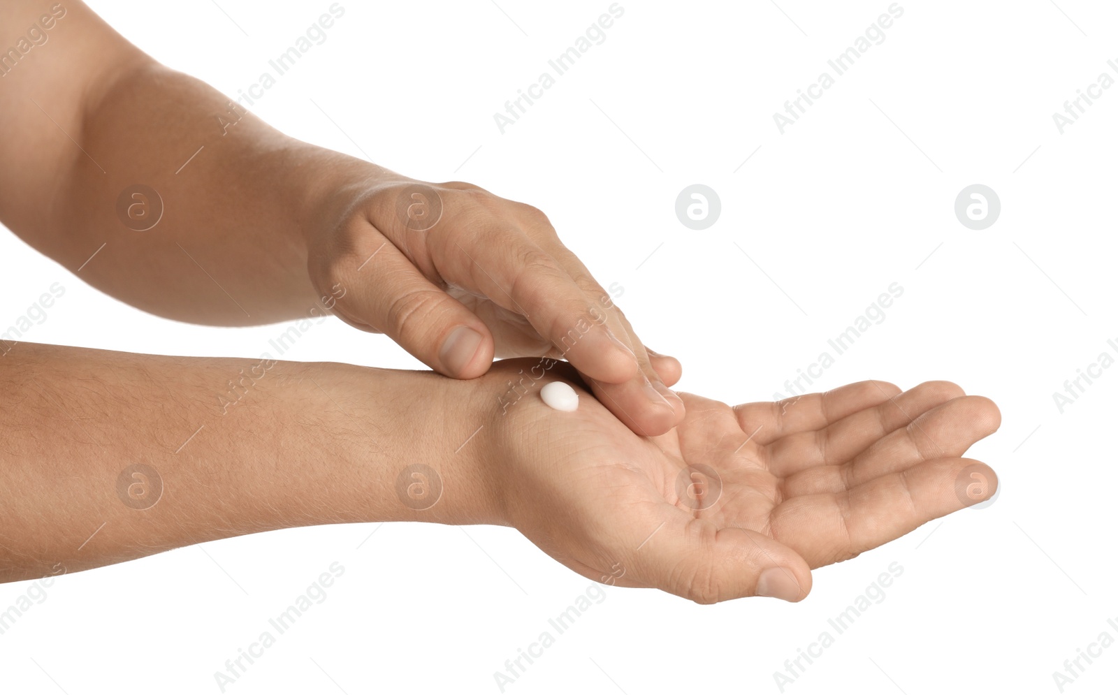 Photo of Man applying cream on hands against white background, closeup