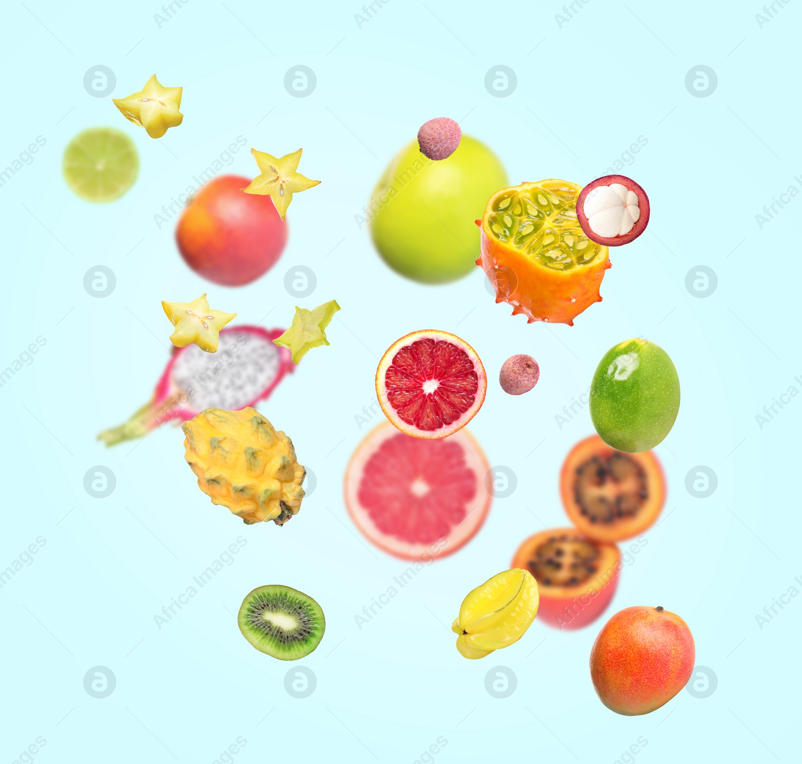 Image of Different tasty exotic fruits flying on turquoise background