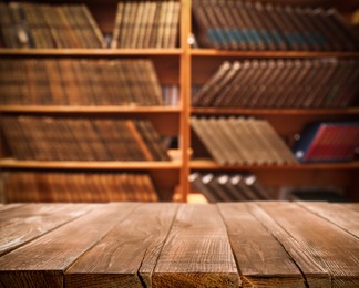 Image of Empty wooden table in library. Space for design 