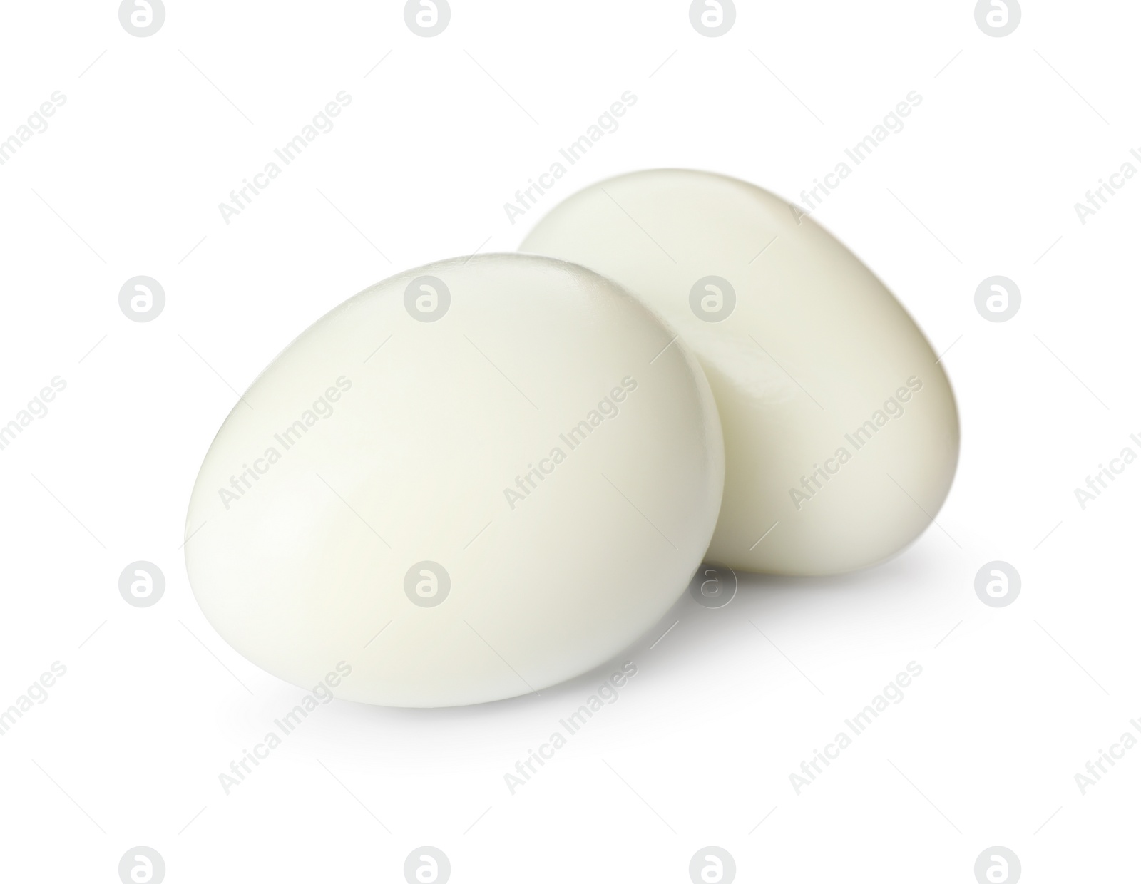 Photo of Two peeled quail eggs isolated on white