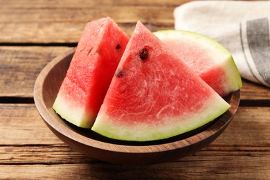 Photo of Delicious fresh watermelon slices on wooden table, closeup