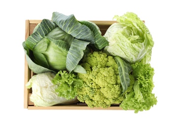 Photo of Wooden crate full of fresh green vegetables on white background, top view