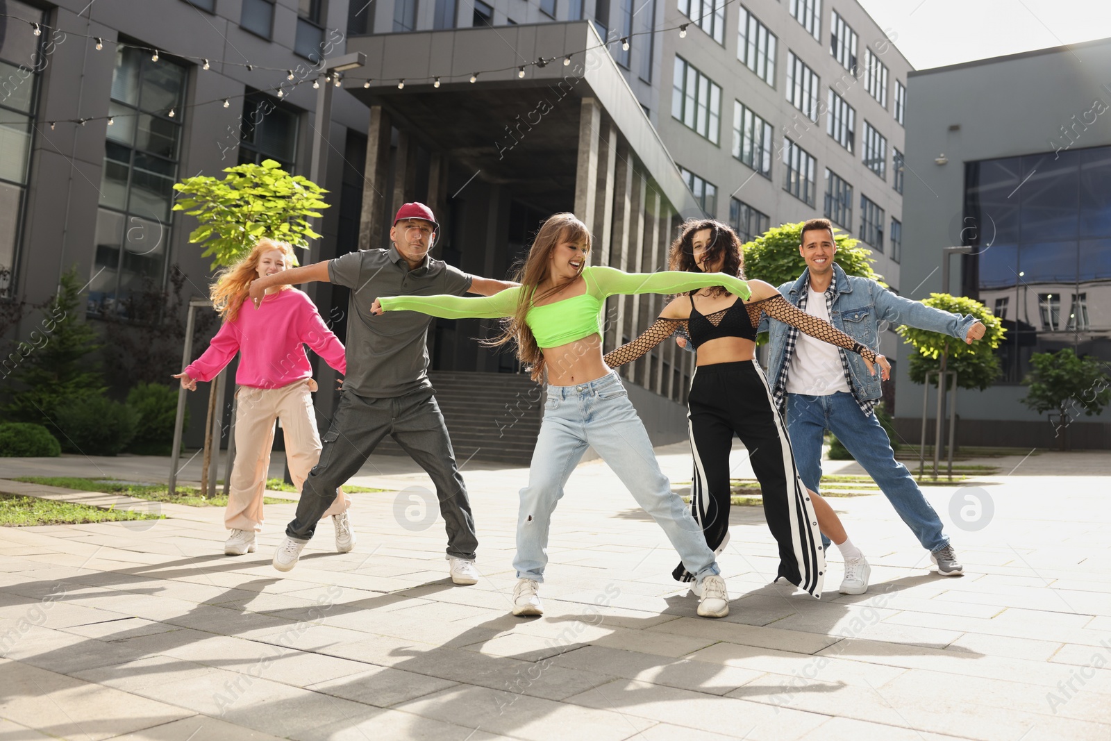 Photo of Group of people dancing hip hop outdoors