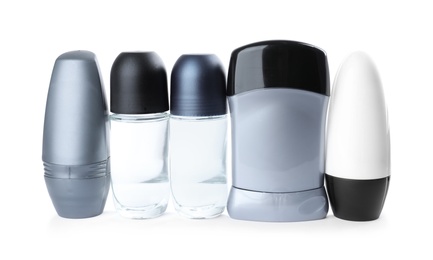 Photo of Different natural male deodorants on white background. Skin care