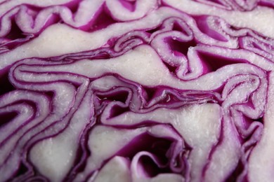Photo of Cut red cabbage as background, closeup view