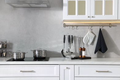 Set of different utensils on countertop in kitchen