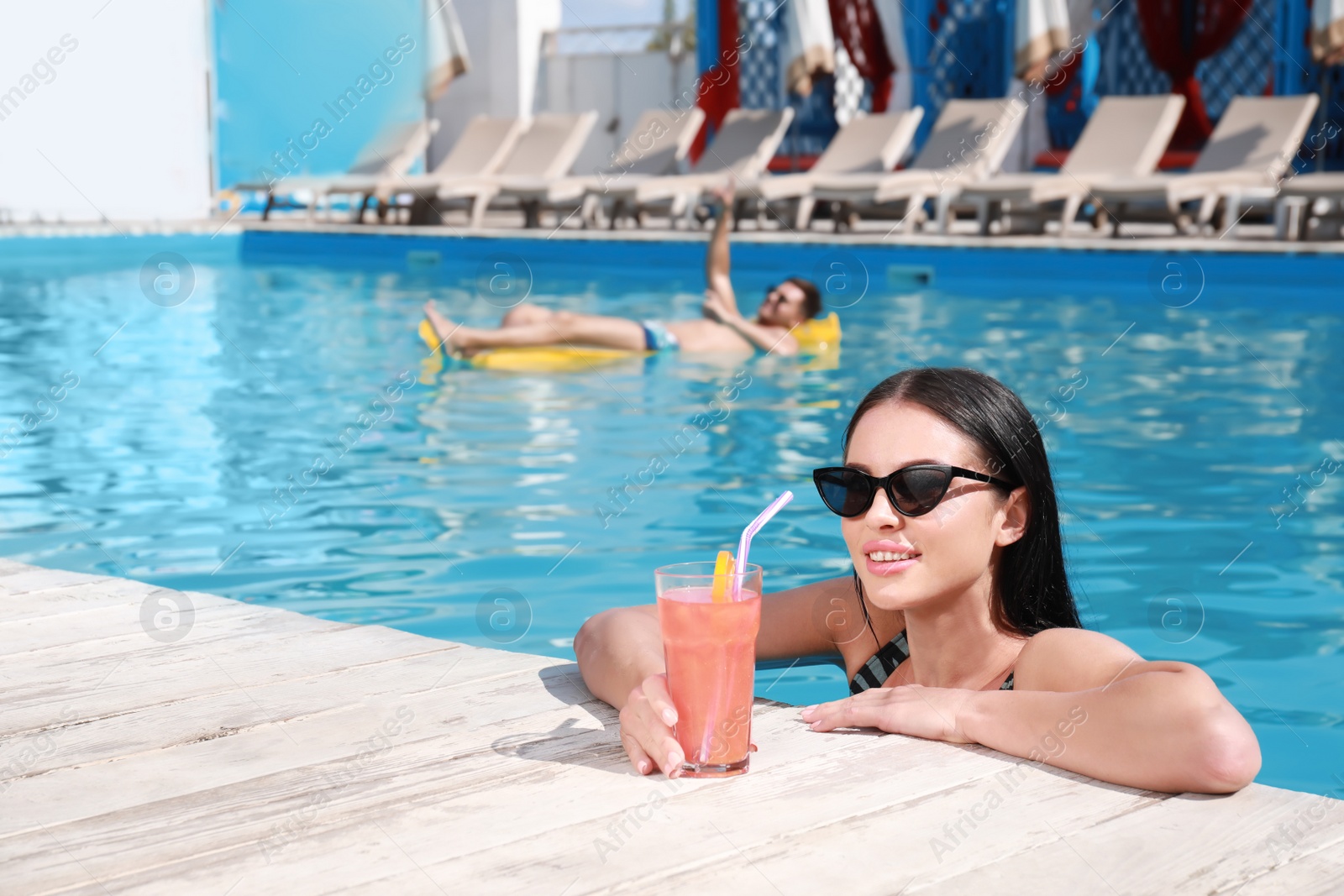 Photo of Happy young couple at resort on sunny day