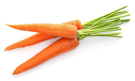 Photo of Ripe fresh carrots on white background