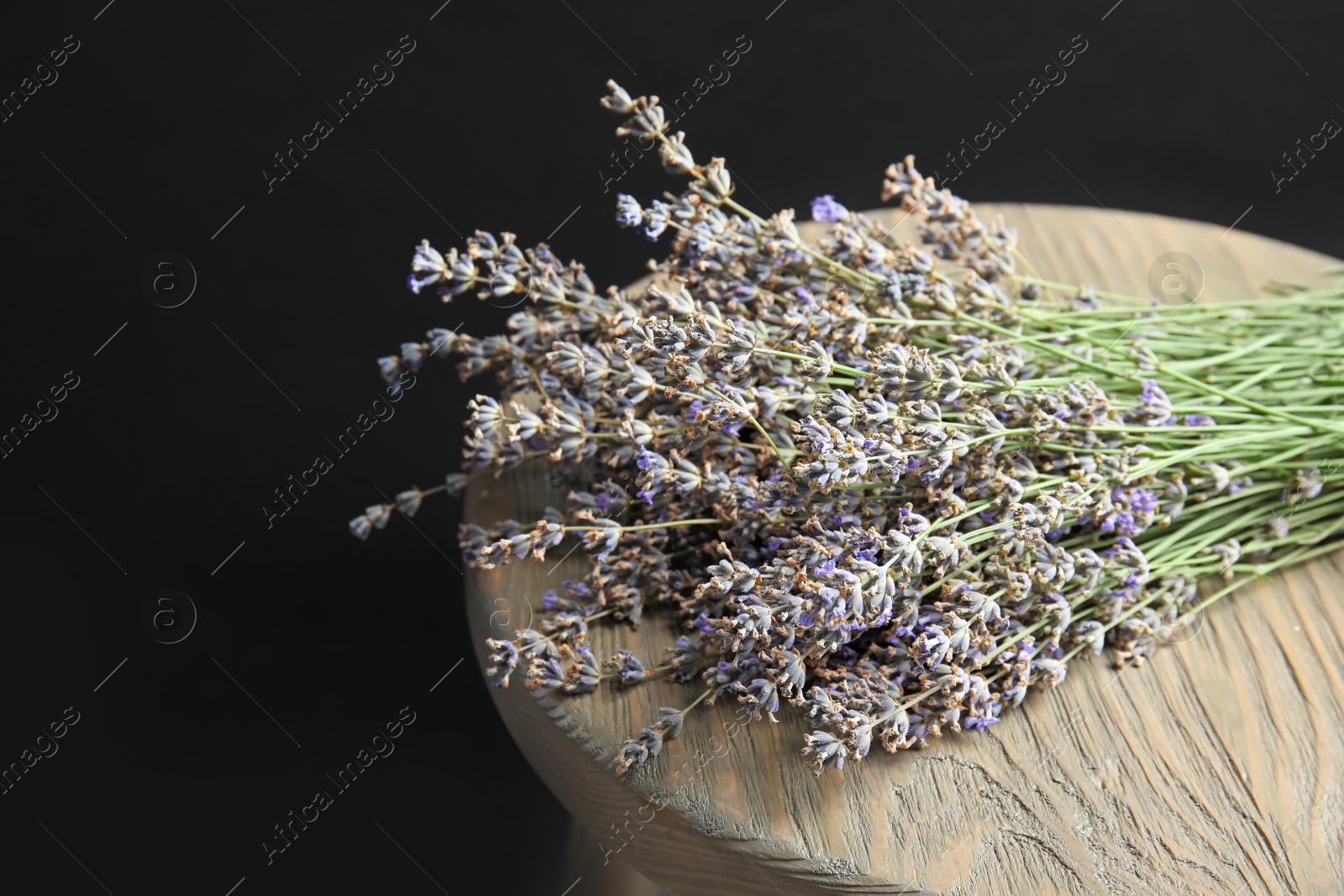 Photo of Beautiful blooming lavender flowers on wooden table