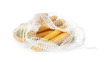 Raw yellow carrots in mesh bag isolated on white