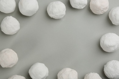Photo of Frame of snowballs on grey background, flat lay. Space for text