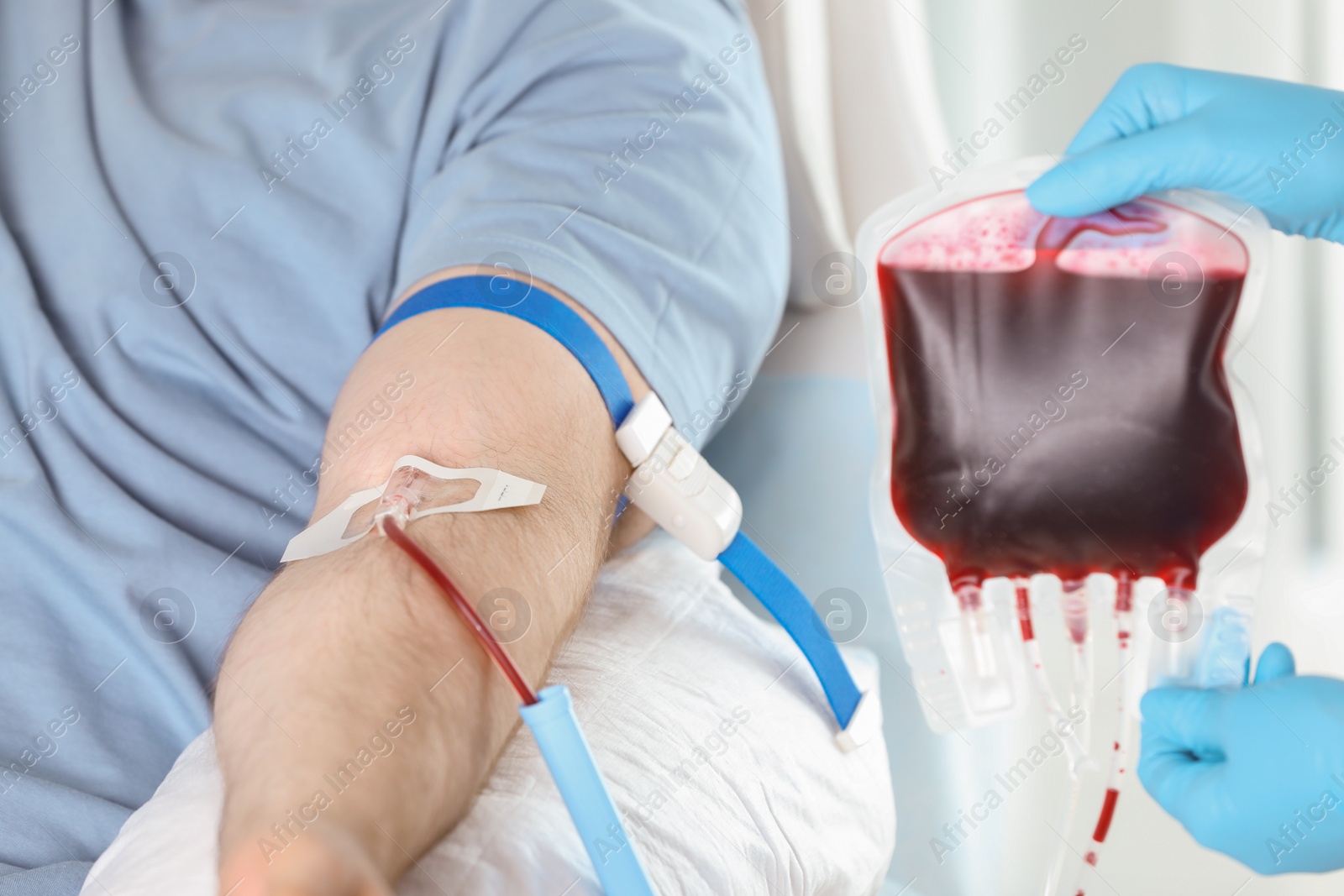 Photo of Man donating blood to save someone's life in hospital