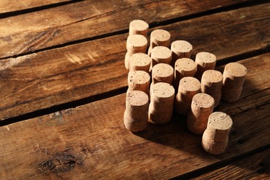 Christmas tree made of wine corks on wooden table. Space for text