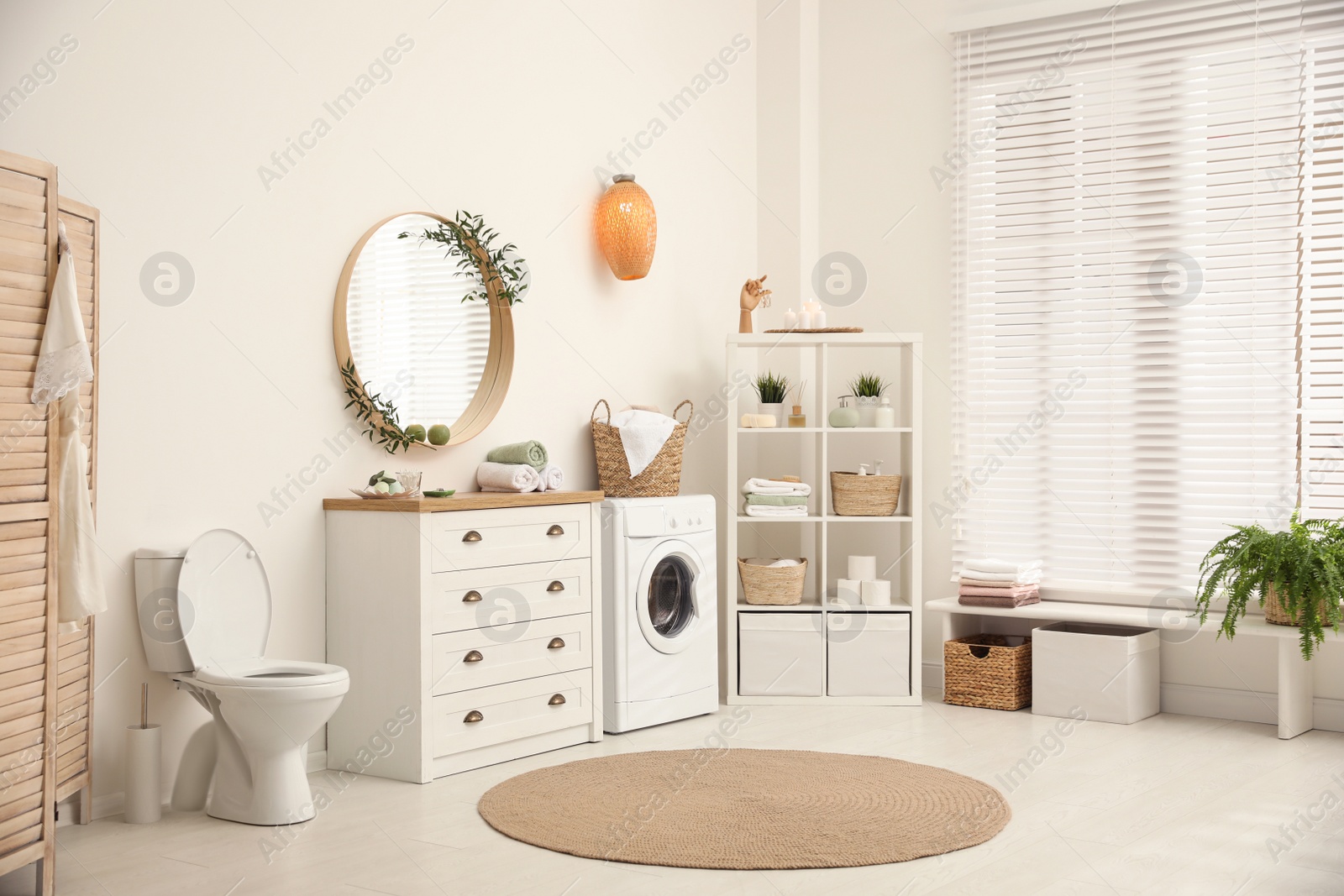 Photo of Interior of stylish bathroom with washing machine