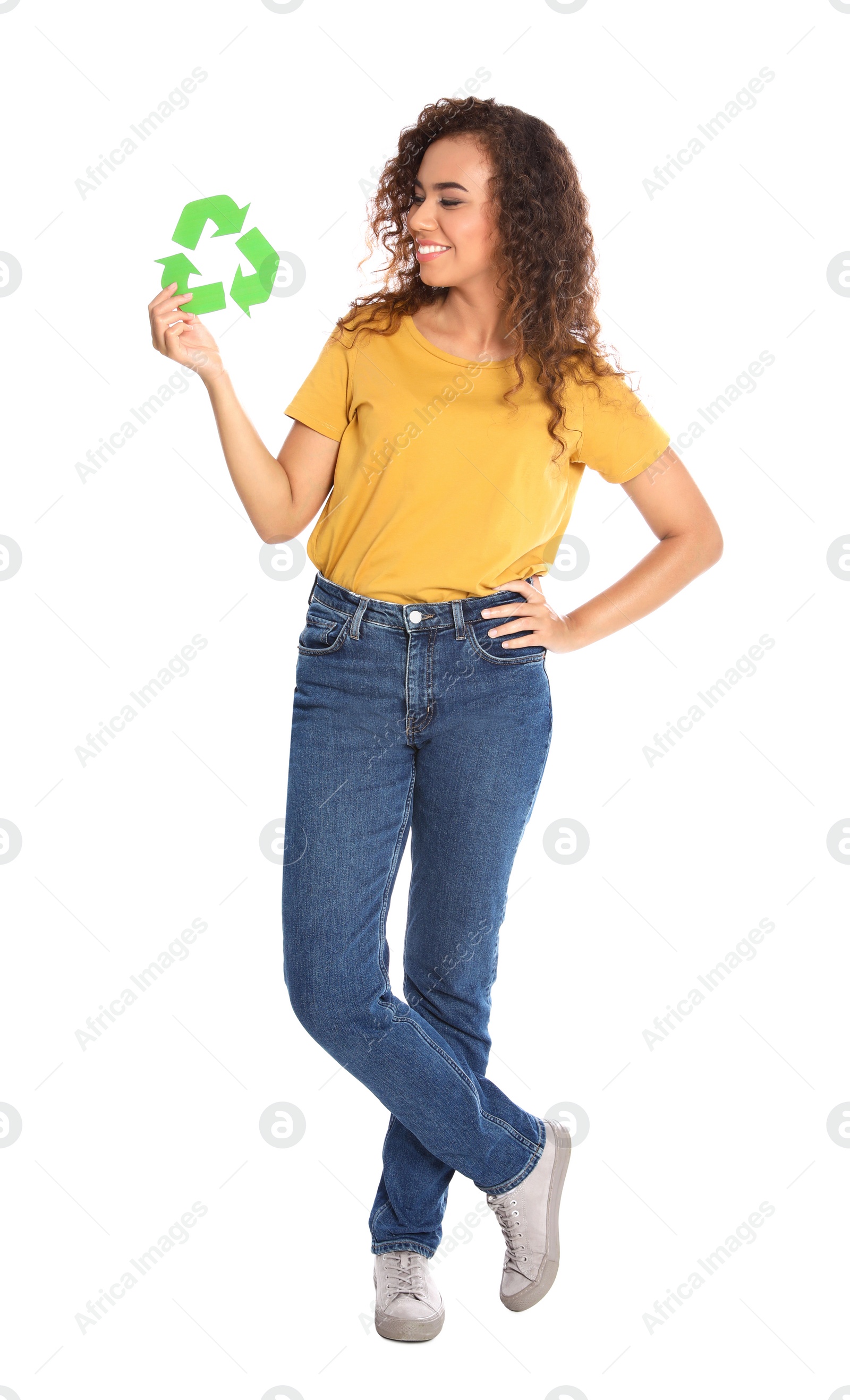 Photo of Young African-American woman with recycling symbol on white background
