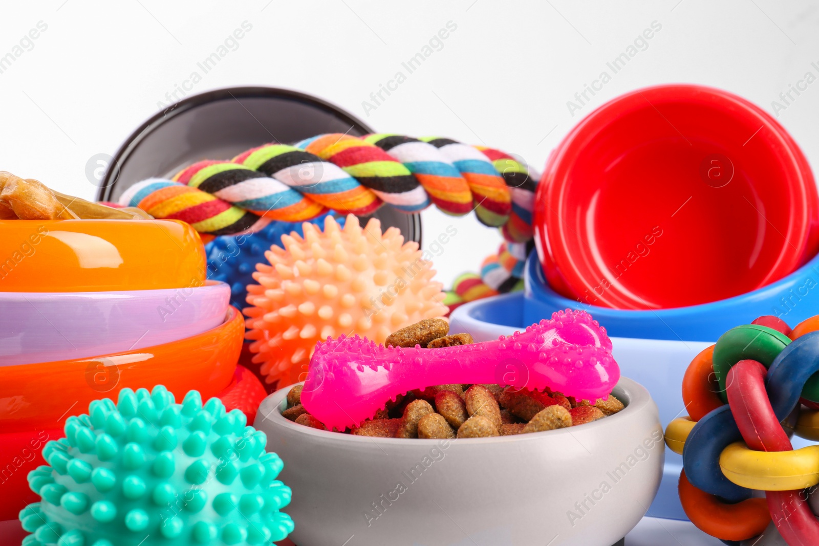 Photo of Different pet goods on white background, closeup. Shop assortment
