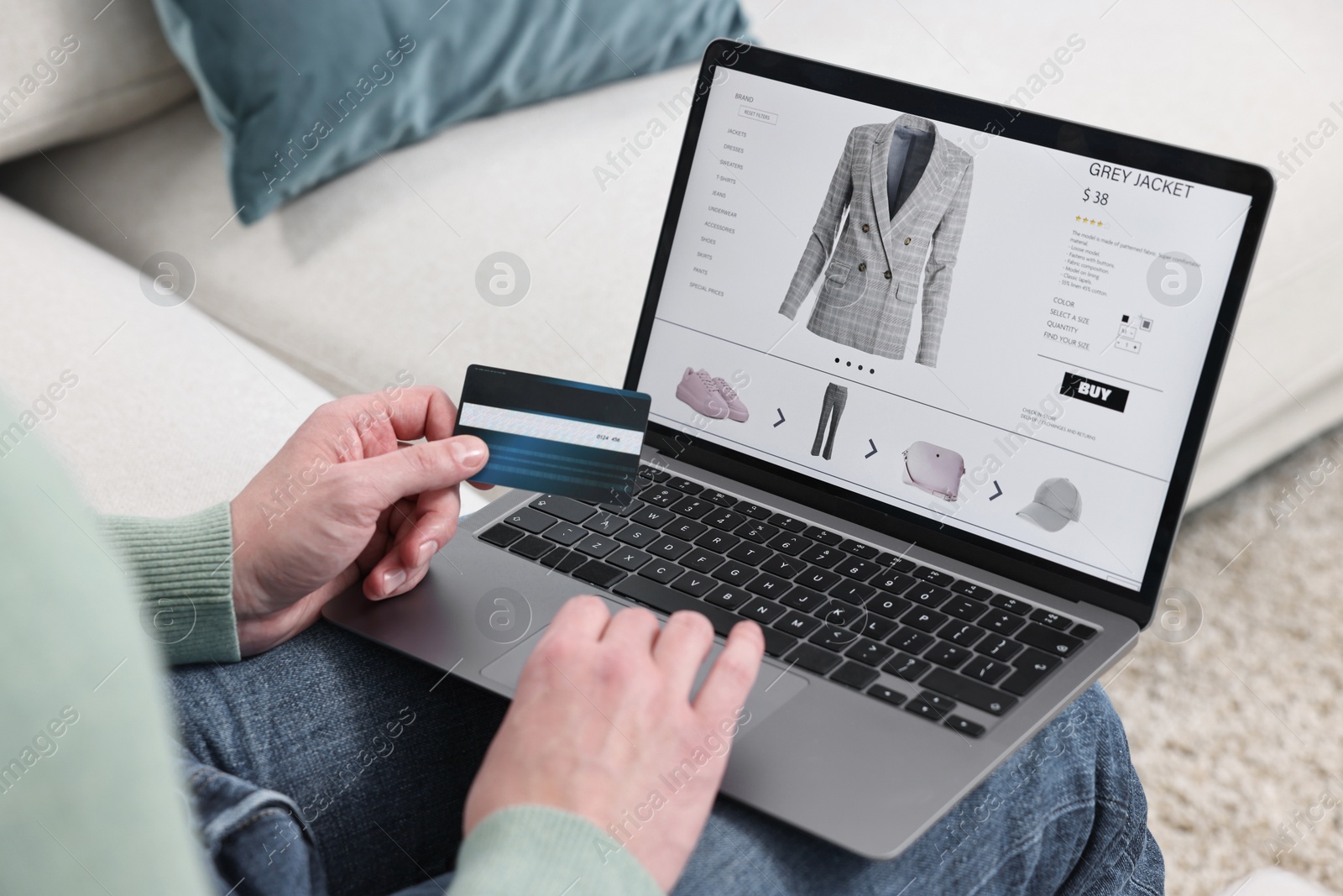 Photo of Man with credit card using laptop for shopping online indoors, closeup